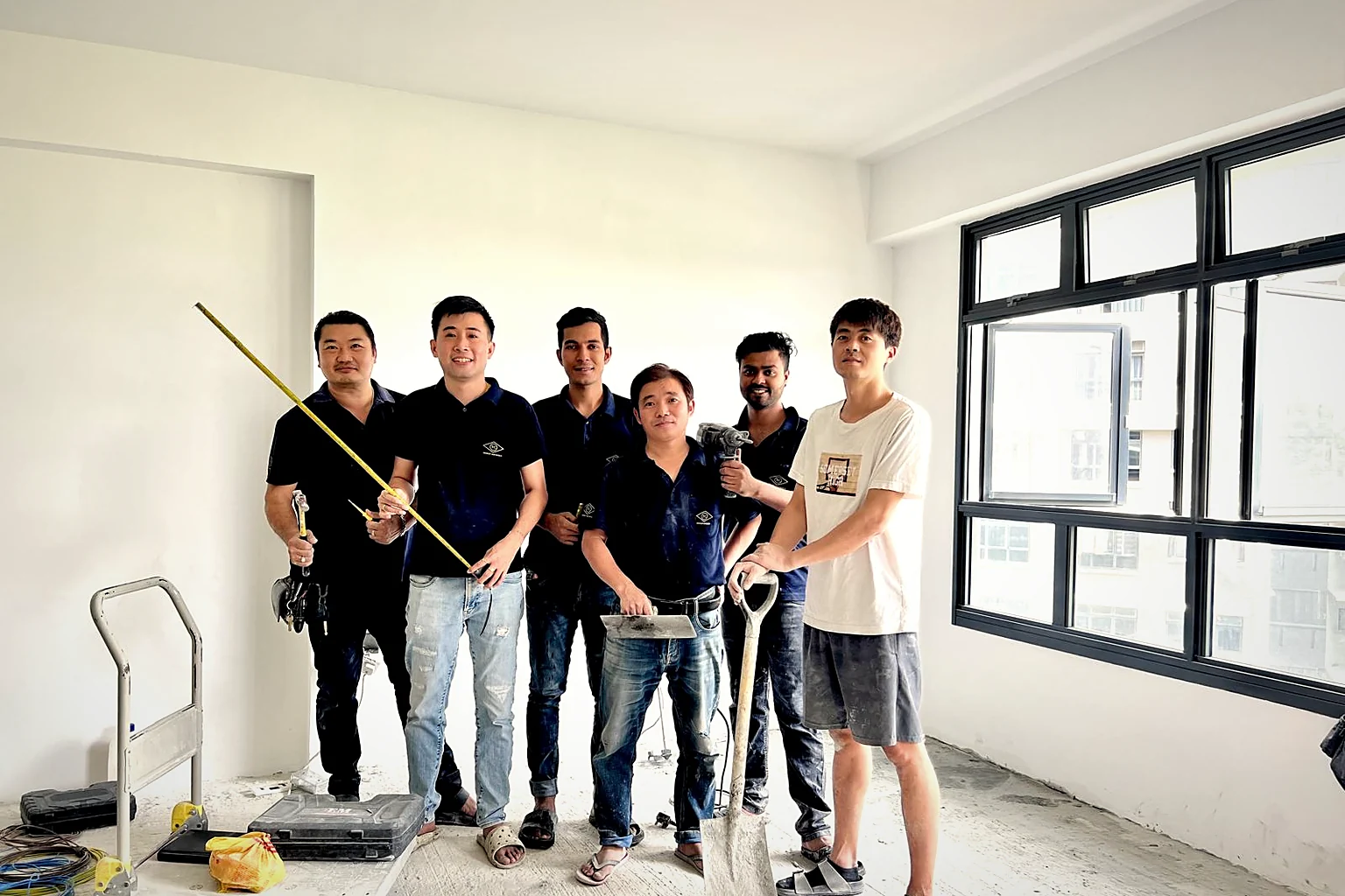 The YC crew on a bare unit with their tools, before the finishes go in