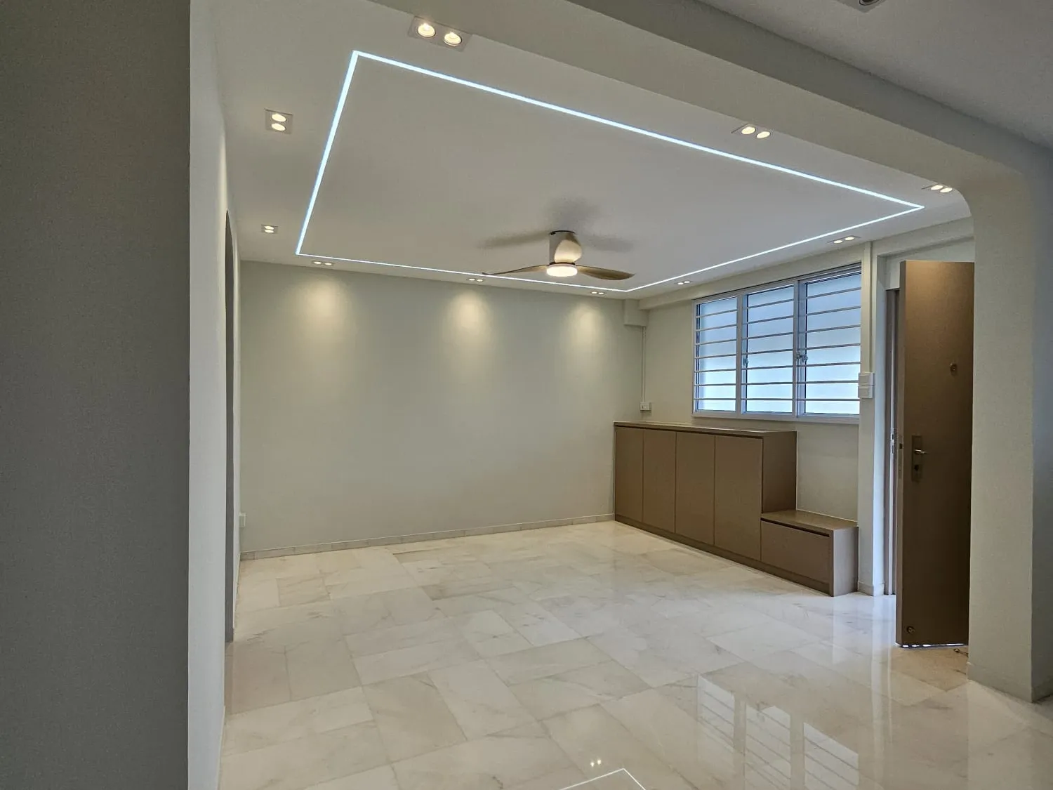 Living room with a lit ceiling outline