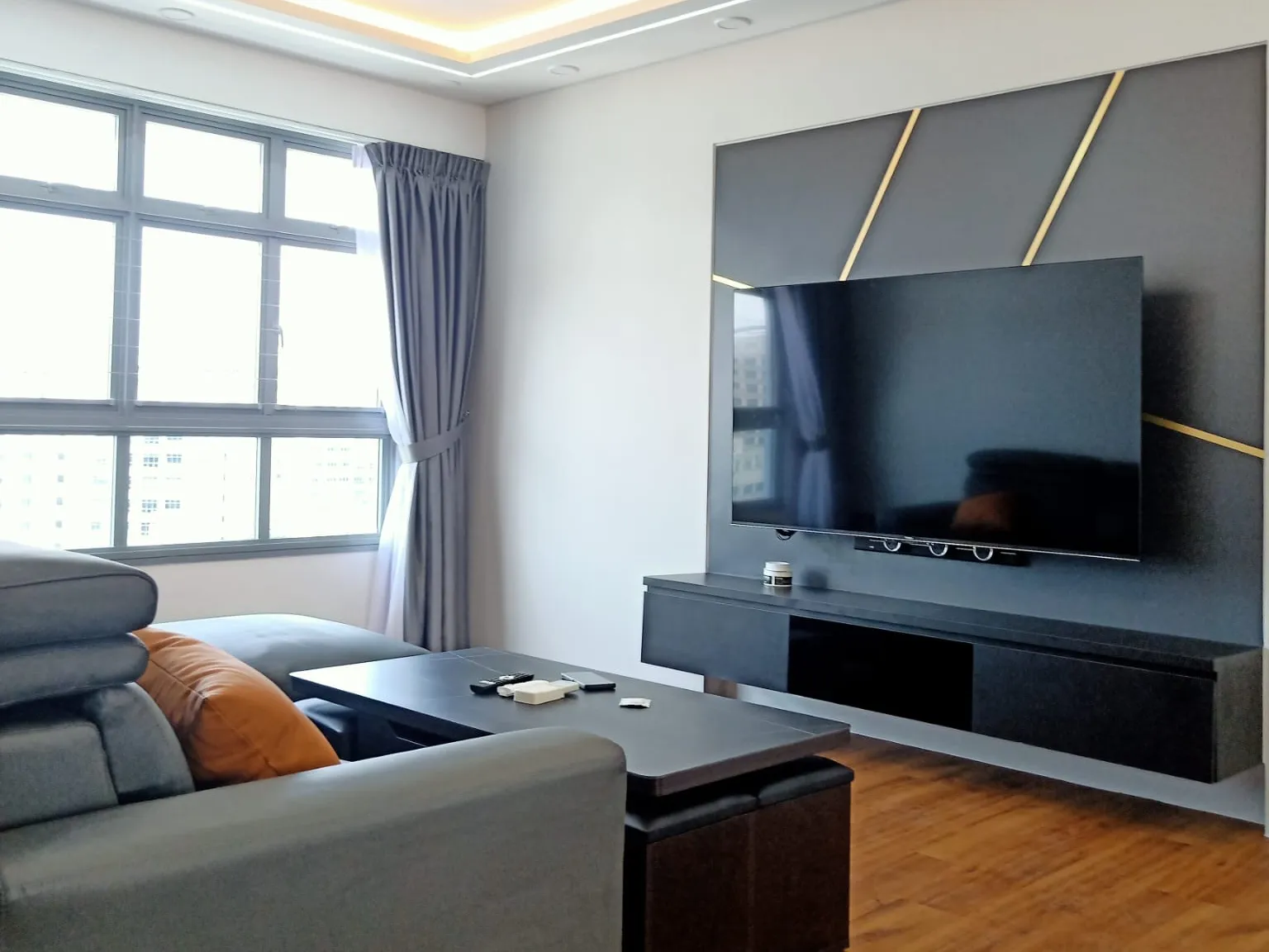 Living room with a panelled TV wall